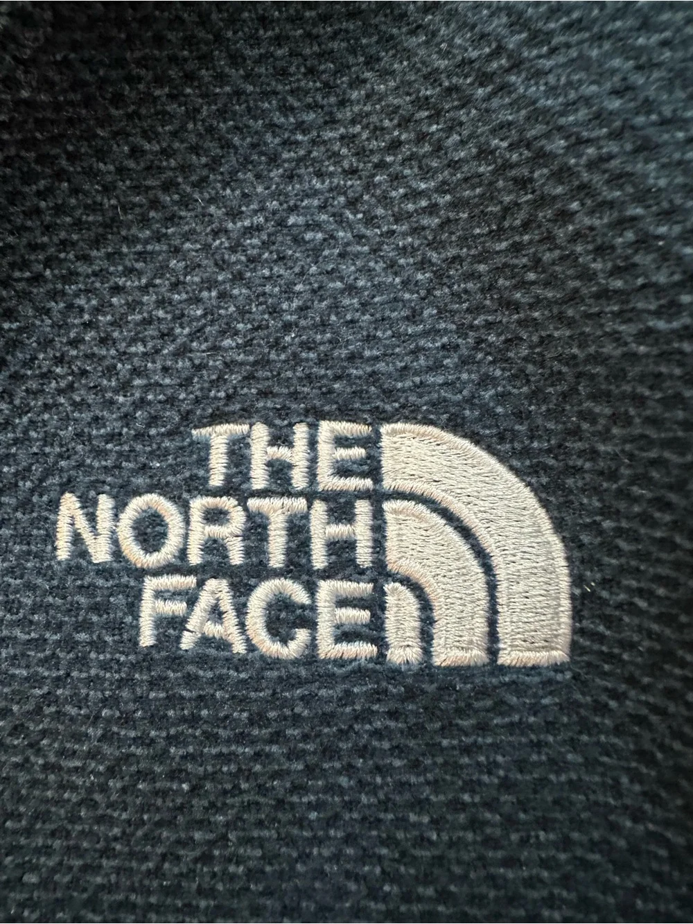The North Face Dark Blue Fleece with White Embroidered Logo